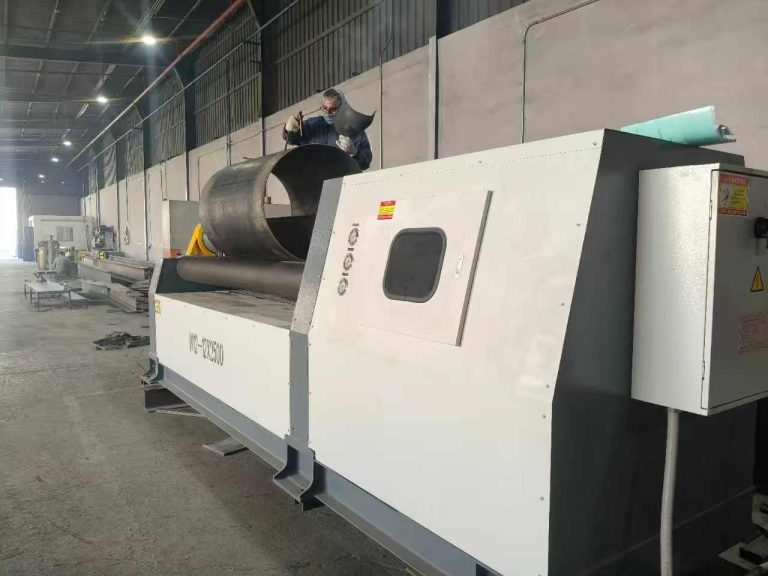 W12-12x2500 four-roll plate rolling machine forming a cylinder with an operator at the machine