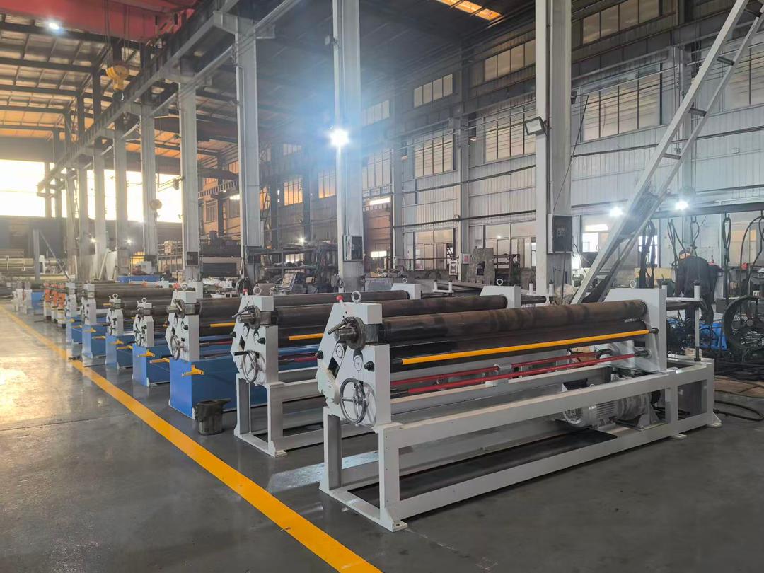 Symmetrical three roll plate bending machine in a factory