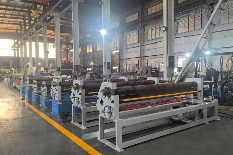 Row of symmetrical three-roll plate rolling machines on a workshop floor