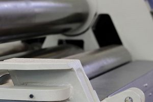 Polished steel rolls of a plate rolling machine close up