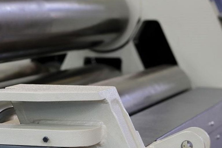 Polished steel rolls of a plate rolling machine close up